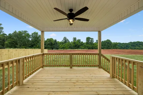 a view of a balcony with wooden floor