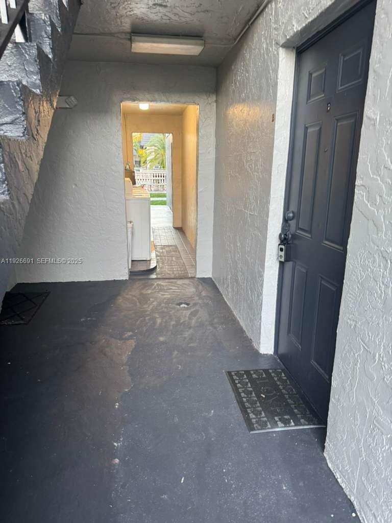 a view of room with window and hardwood floor