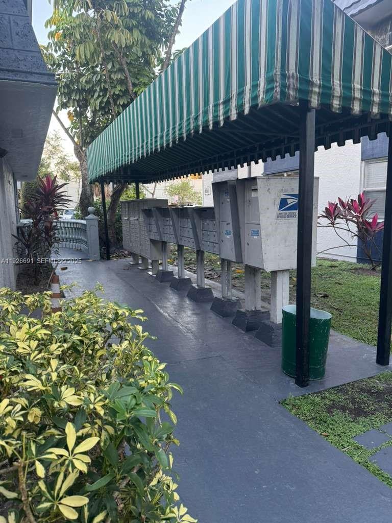 8003 West 6th Avenue, Unit B Hialeah, FL 33014 - Photo 17 of 19 a view of a street with a small yard