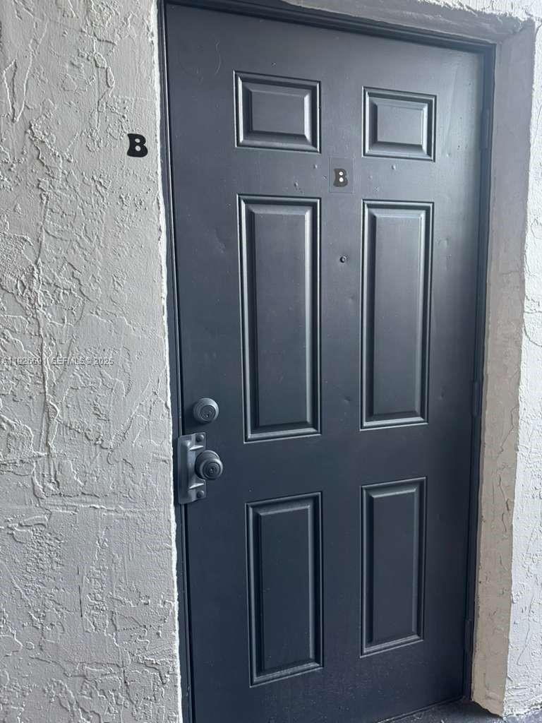 8003 West 6th Avenue, Unit B Hialeah, FL 33014 - Photo 2 of 19 view of a brick wall