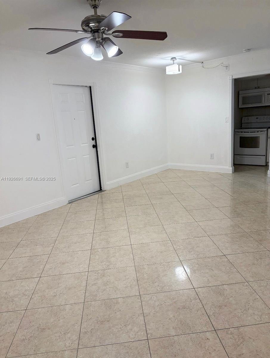 8003 West 6th Avenue, Unit B Hialeah, FL 33014 - Photo 3 of 19 a view of an empty room with a window