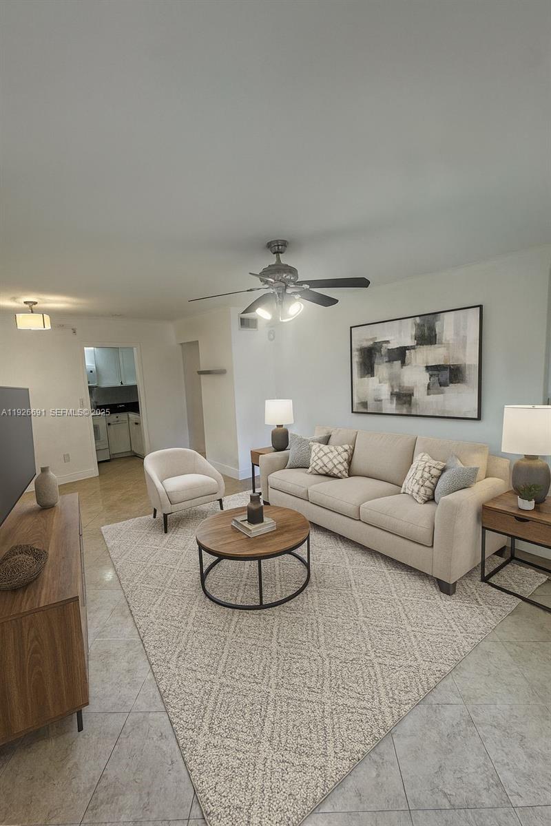 8003 West 6th Avenue, Unit B Hialeah, FL 33014 - Photo 4 of 19 a living room with furniture and white walls