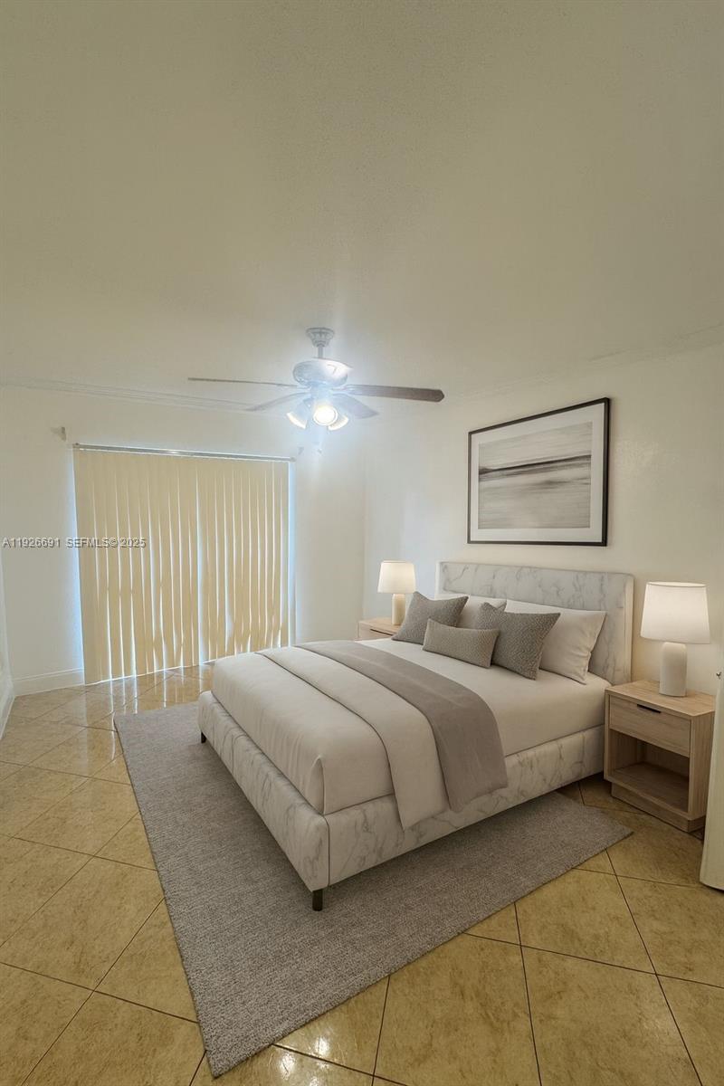 8003 West 6th Avenue, Unit B Hialeah, FL 33014 - Photo 7 of 19 a bedroom with a bed and a lamp with the dresser