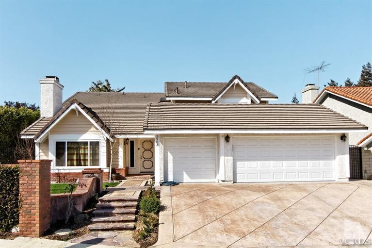 3903 Southhampton Road Moorpark, CA 93021 - Photo 1 of 29 a front view of a house with a yard