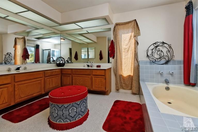 3903 Southhampton Road Moorpark, CA 93021 - Photo 15 of 29 a spacious bathroom with a tub sink and mirror