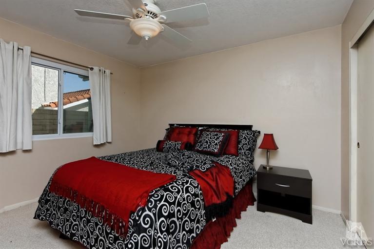 3903 Southhampton Road Moorpark, CA 93021 - Photo 21 of 29 a bedroom with a bed and a window