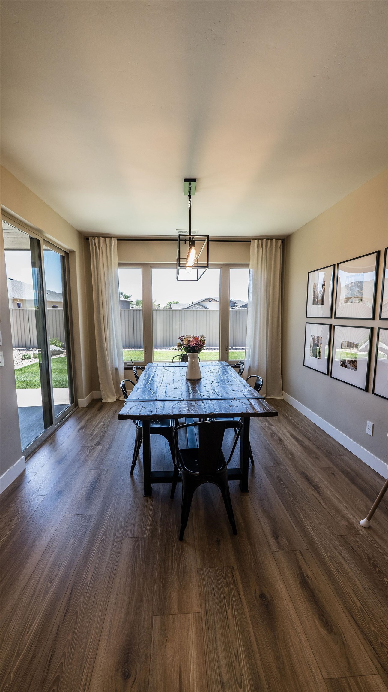 2639 Emerald Ridge Lane Grand Junction, CO 81506 - Photo 7 of 42 a view of a dining room with furniture window and wooden floor