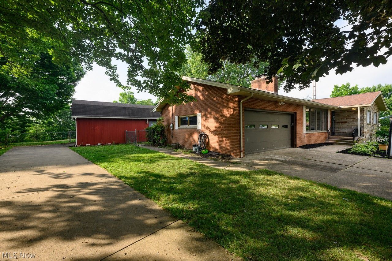 3912 Rolling Ridge Road Northeast Canton, OH 44721 - Photo 23 of 33 Side of home attached garage and separate driveway to storage shed