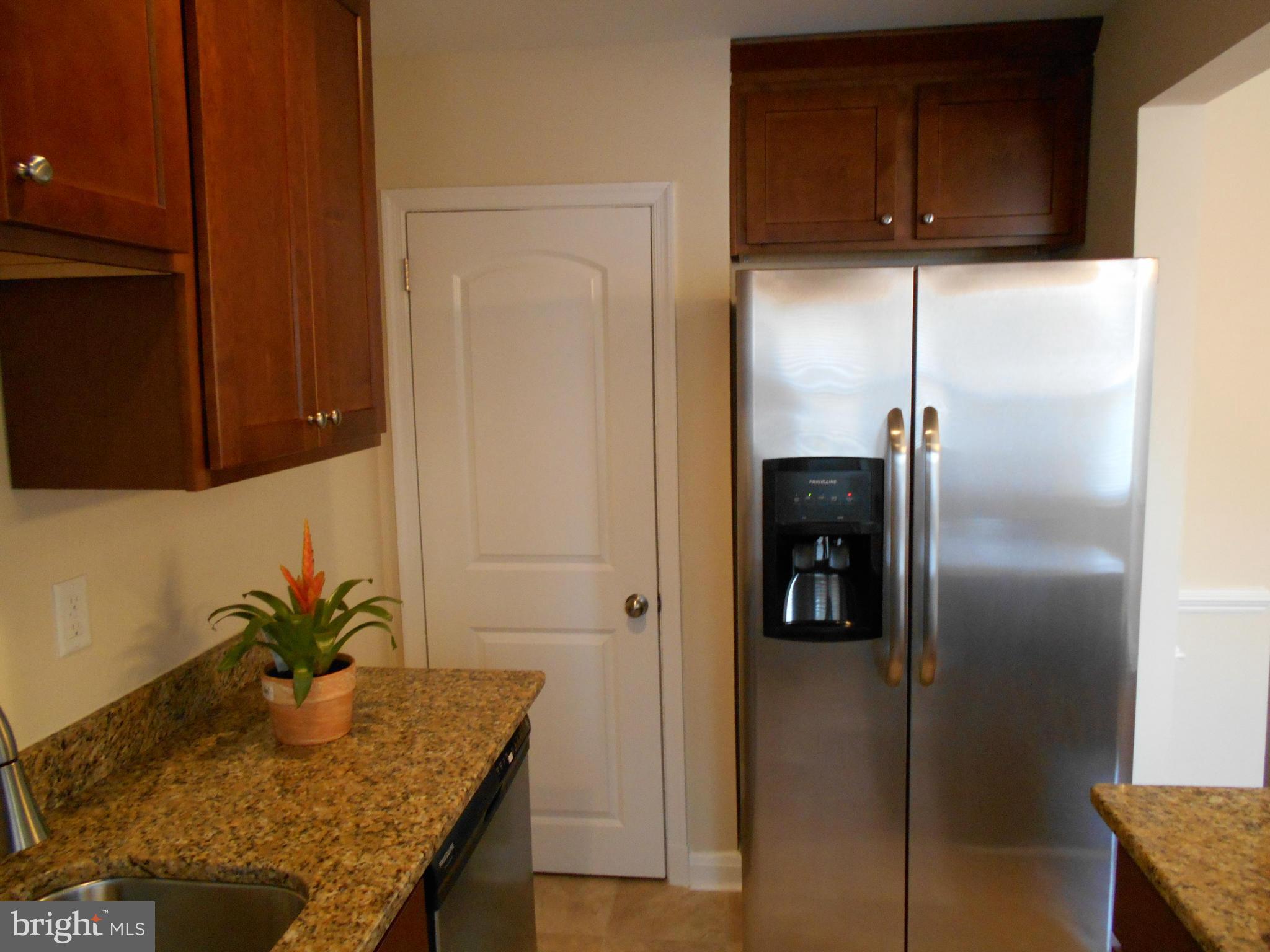 418 Torner Road Baltimore, MD 21221 - Photo 8 of 30 a kitchen with a refrigerator and cabinets