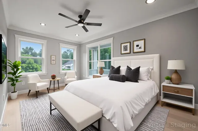 a bedroom with bed and large window