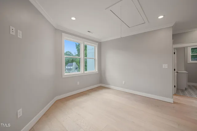 a view of an empty room with a window