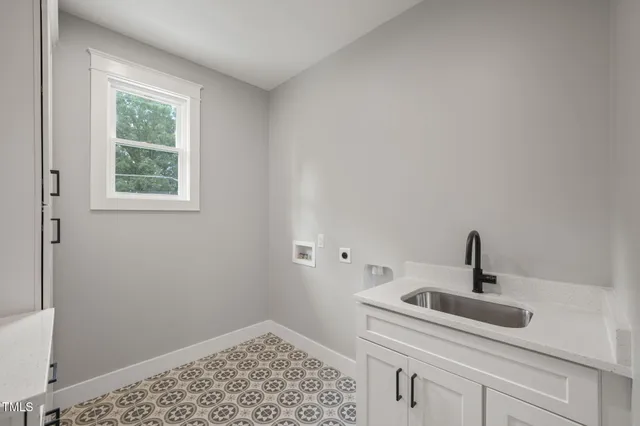 a bathroom with a sink and vanity