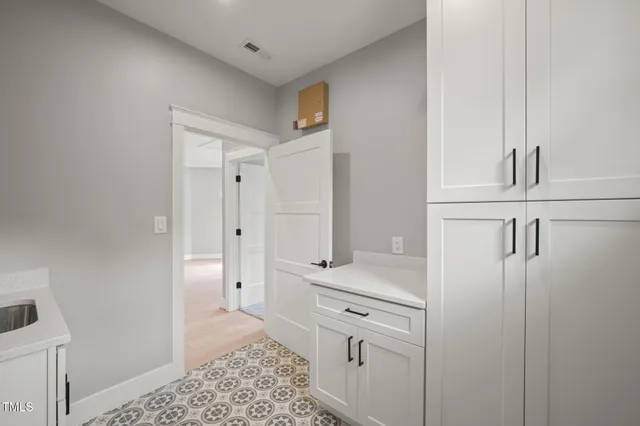 a bathroom with a shower and a sink