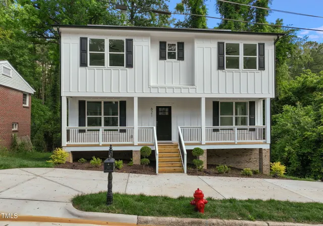 a house with lots of trees in the background