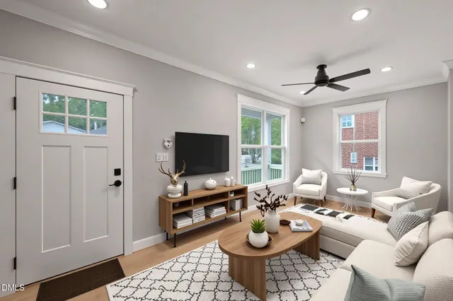 a living room with furniture and a flat screen tv