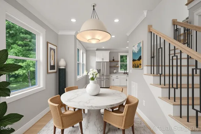 a view of a dining room with furniture window and wooden floor