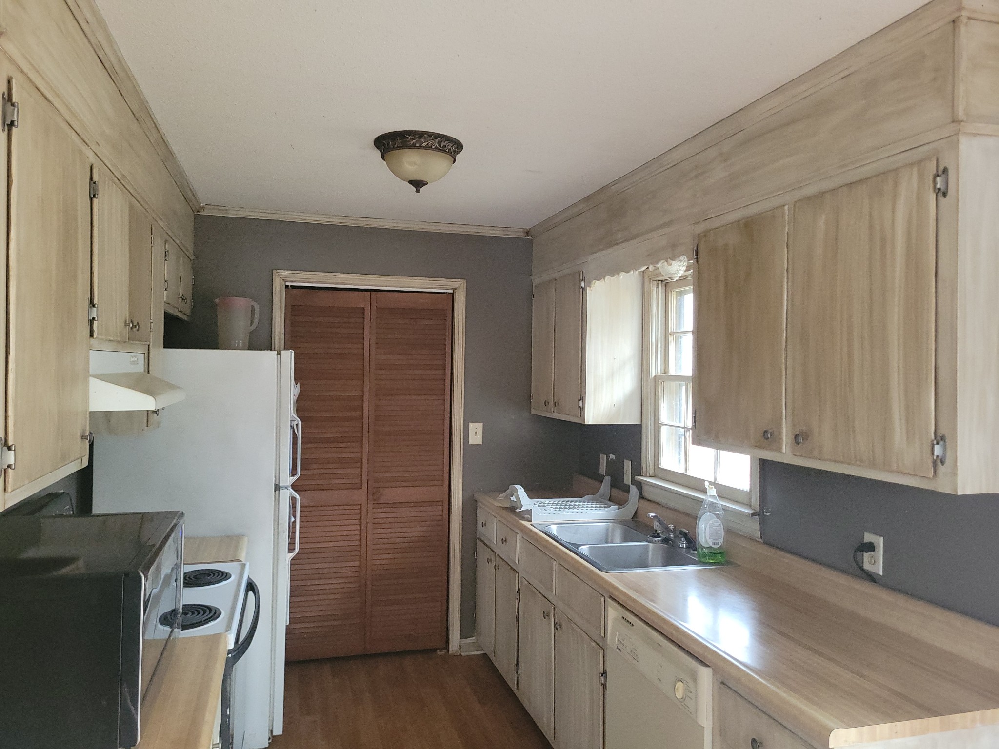 171 Trinity Lane Pulaski, TN 38478 - Photo 6 of 16 a kitchen with a refrigerator and a sink
