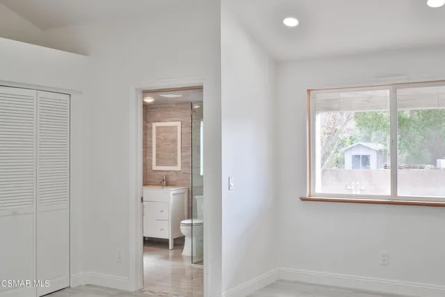 a view of a room that has a window in it