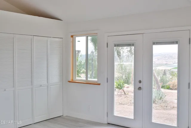 a view of an empty room and window