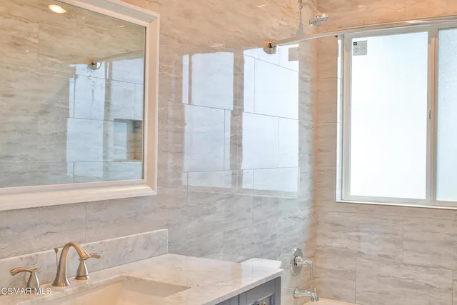 a bathroom with a sink and a shower