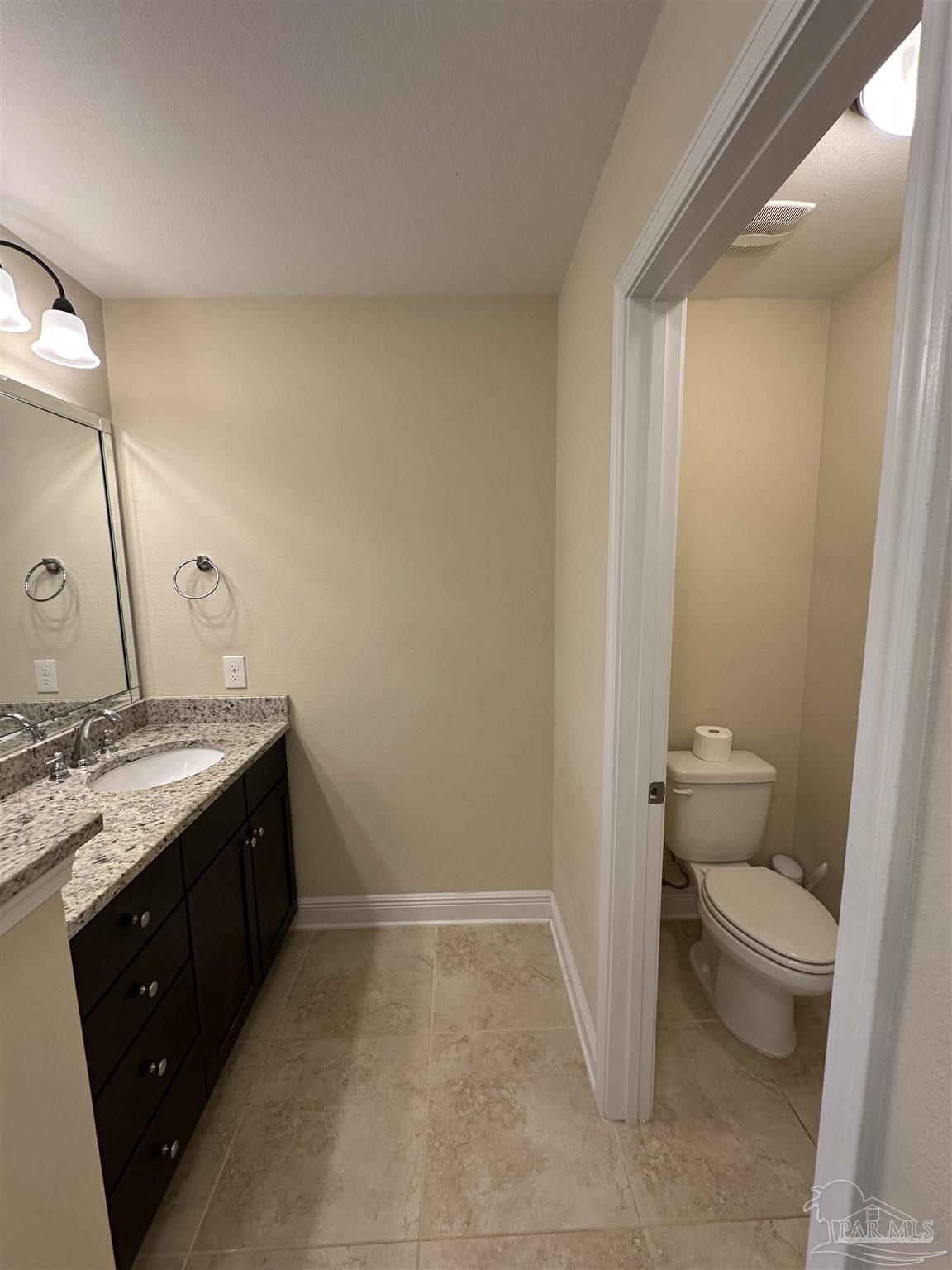 7329 Farmers Road Pensacola, FL 32526 - Photo 16 of 27 a bathroom with a granite countertop sink and a mirror