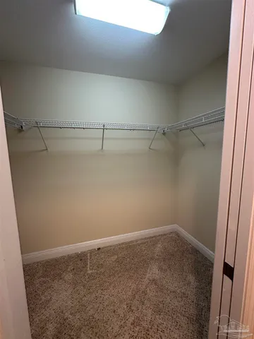 a view of a room with racks on the wall