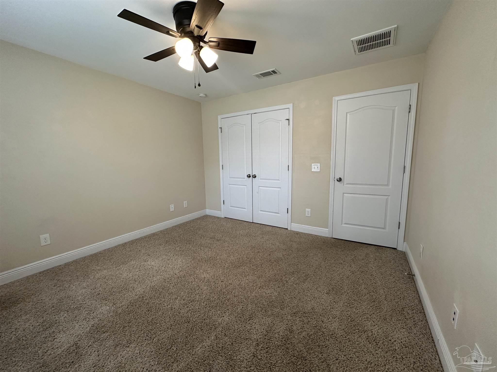 7329 Farmers Road Pensacola, FL 32526 - Photo 20 of 27 a view of a livingroom with a ceiling fan and window