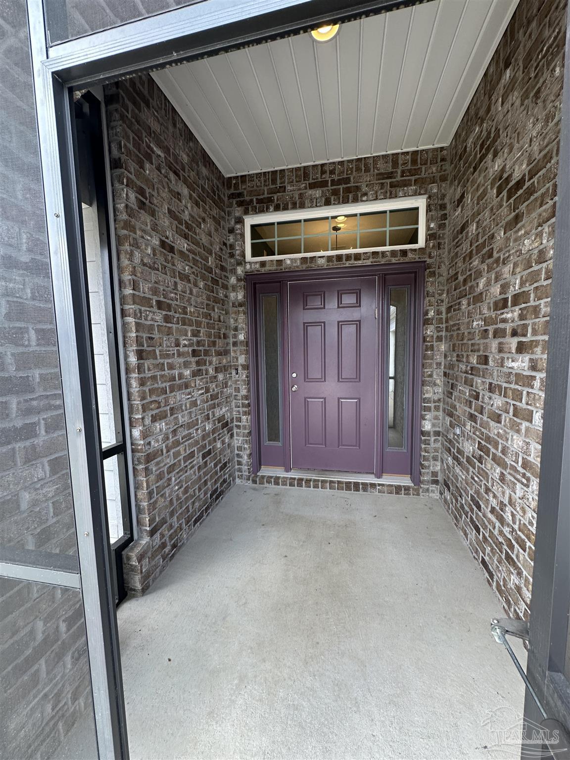 7329 Farmers Road Pensacola, FL 32526 - Photo 4 of 27 a view of wooden door and brick wall