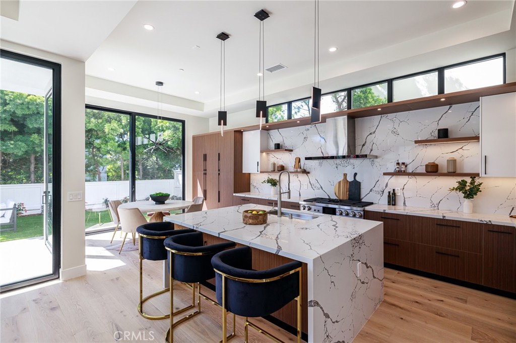 1813 Walnut Avenue Manhattan Beach, CA 90266 - Photo 20 of 73 a kitchen with a sink stove and cabinets