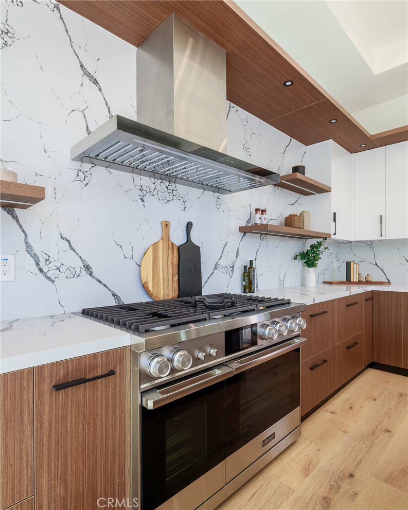 1813 Walnut Avenue Manhattan Beach, CA 90266 - Photo 25 of 73 a kitchen with stainless steel appliances granite countertop a stove and a sink