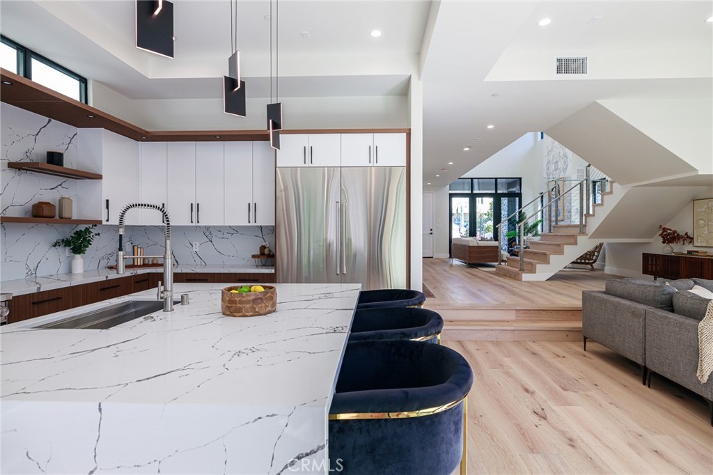 1813 Walnut Avenue Manhattan Beach, CA 90266 - Photo 30 of 73 a kitchen with stainless steel appliances a stove a sink and a refrigerator
