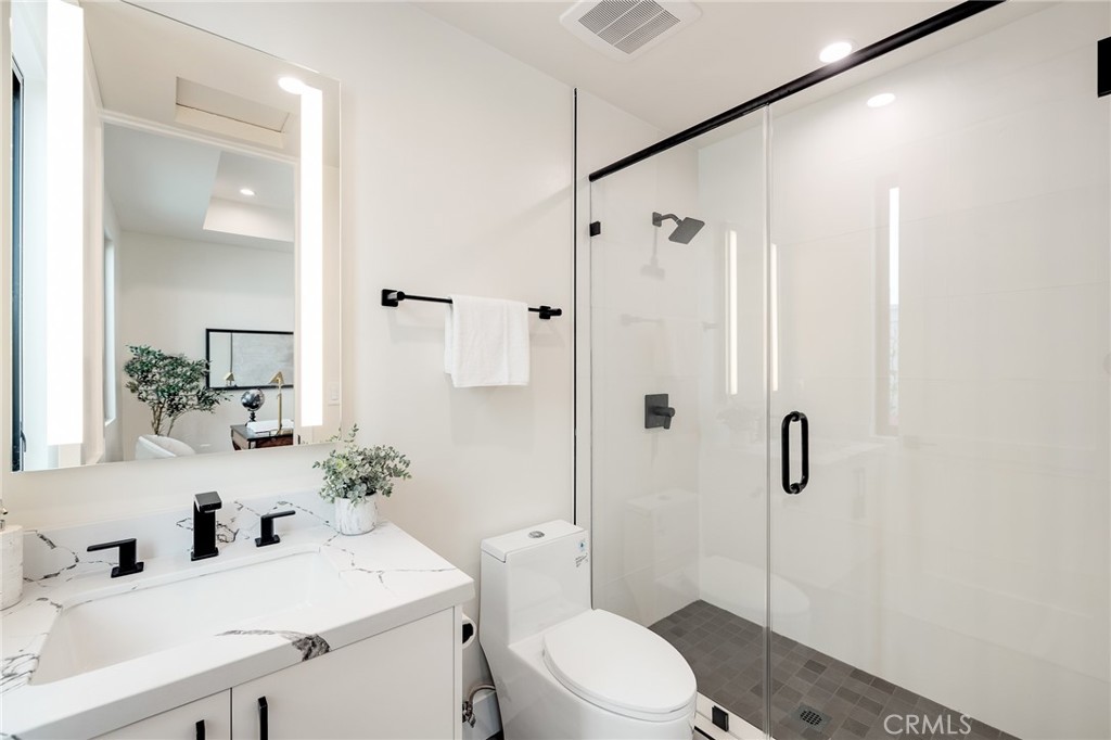 1813 Walnut Avenue Manhattan Beach, CA 90266 - Photo 44 of 73 a bathroom with a sink toilet vanity and shower