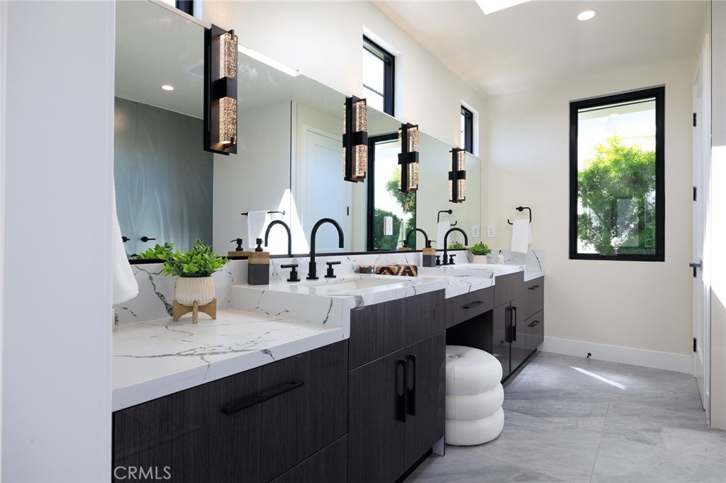 1813 Walnut Avenue Manhattan Beach, CA 90266 - Photo 71 of 73 a bathroom with a double vanity sink and a mirror