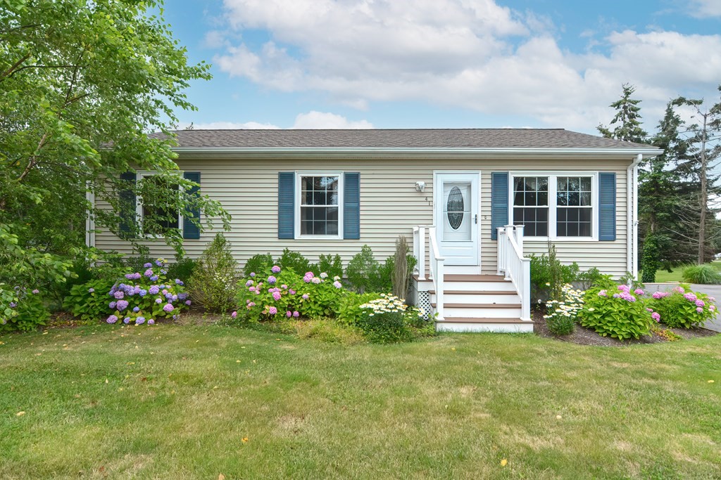 front view of a house with a yard