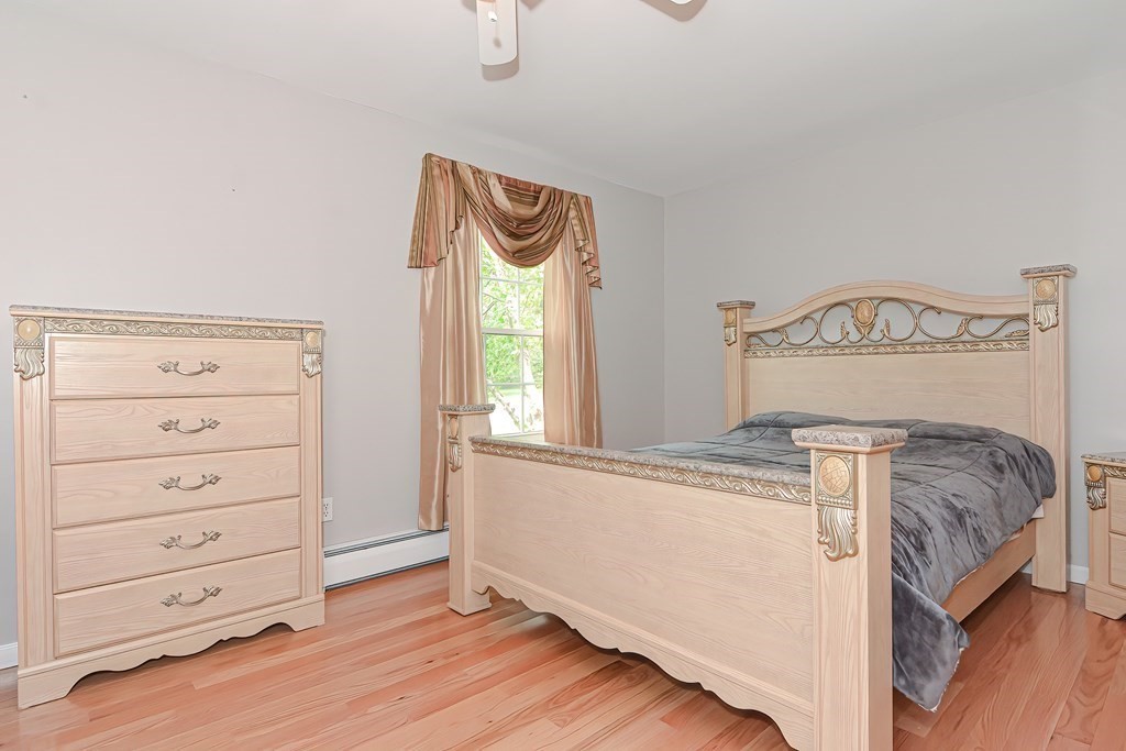 41 Boston Hill Road Fairhaven, MA 02719 - Photo 11 of 32 a bedroom with a bed and a window