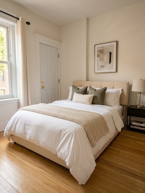 36 Winchester Street, Unit 2 Brookline, MA 02446 - Photo 6 of 14 a bedroom with a bed and a window