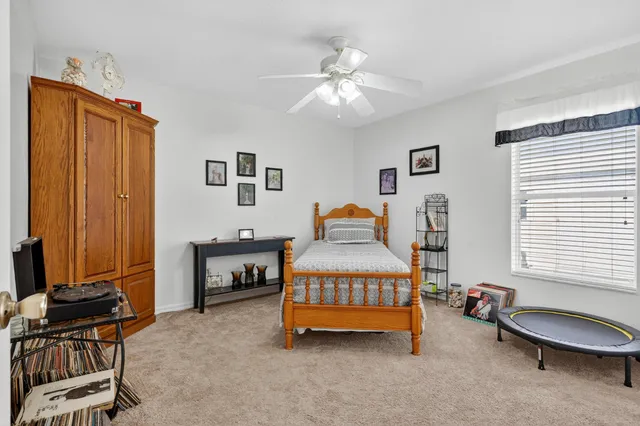 a bedroom with furniture and a window
