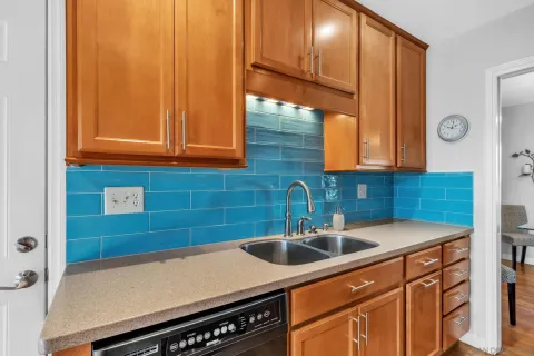 a kitchen with a sink and cabinets