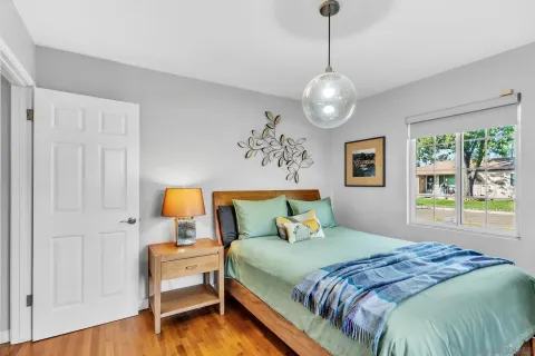 a bedroom with a bed and a window