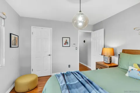 a bedroom with bed and window