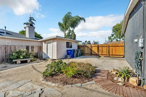 a view of a chairs and table in patio