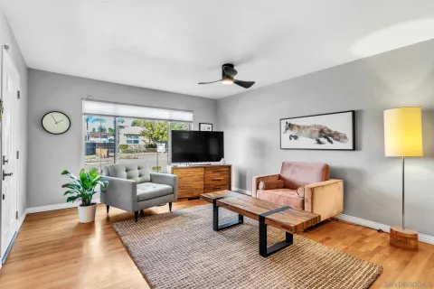 a living room with furniture and a flat screen tv