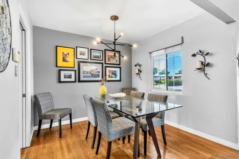a dining room with furniture and window