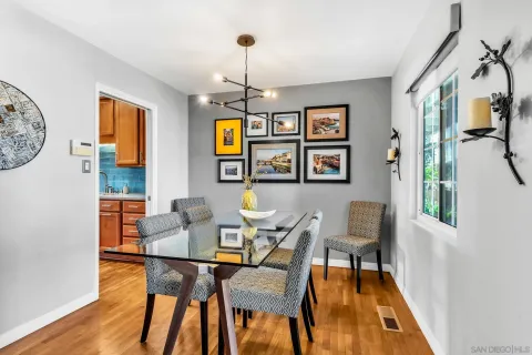 a dining room with furniture and window