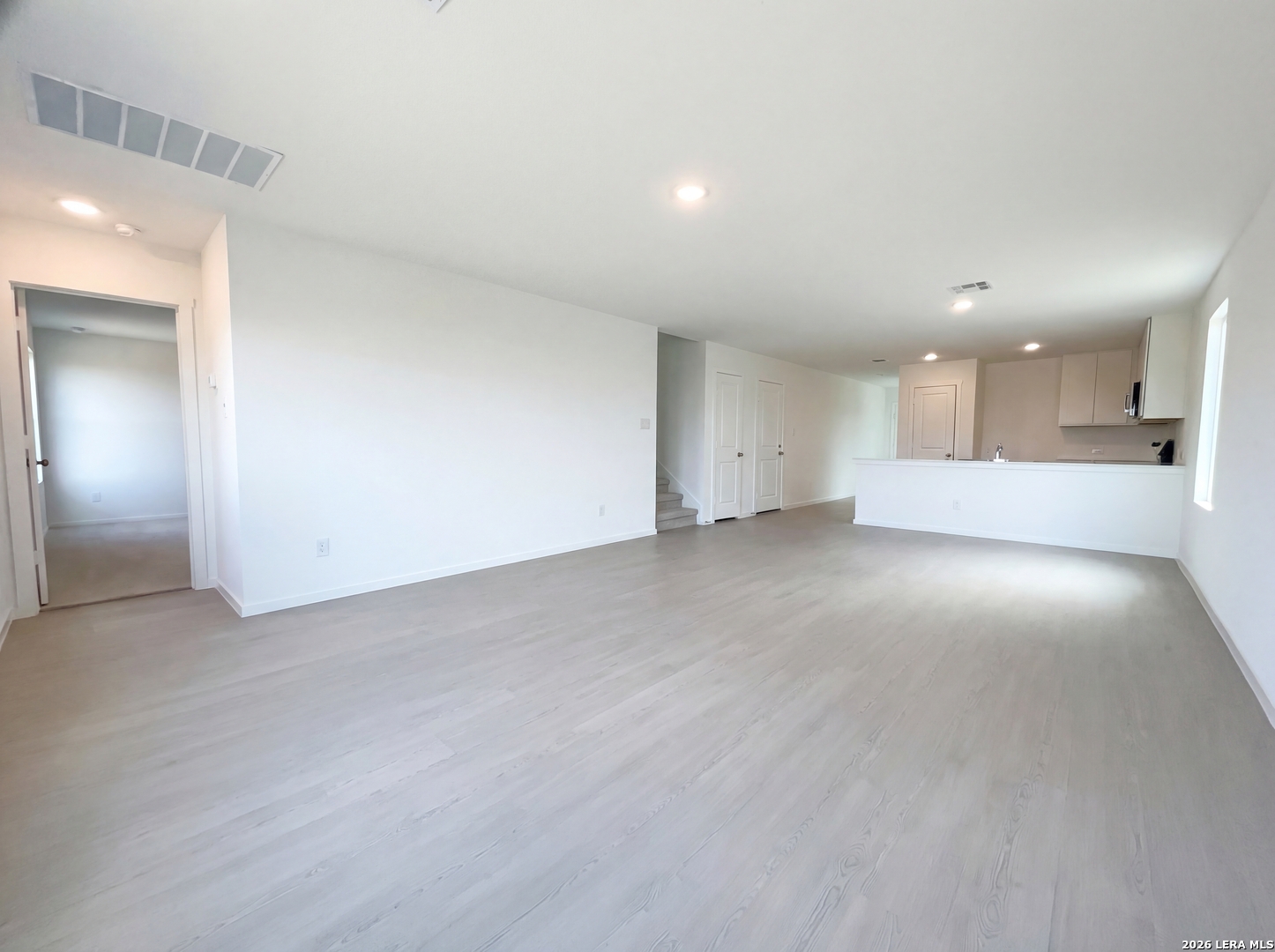 320 Pacific Waters Seguin, TX 78155 - Photo 3 of 16 an empty room with a empty space and windows