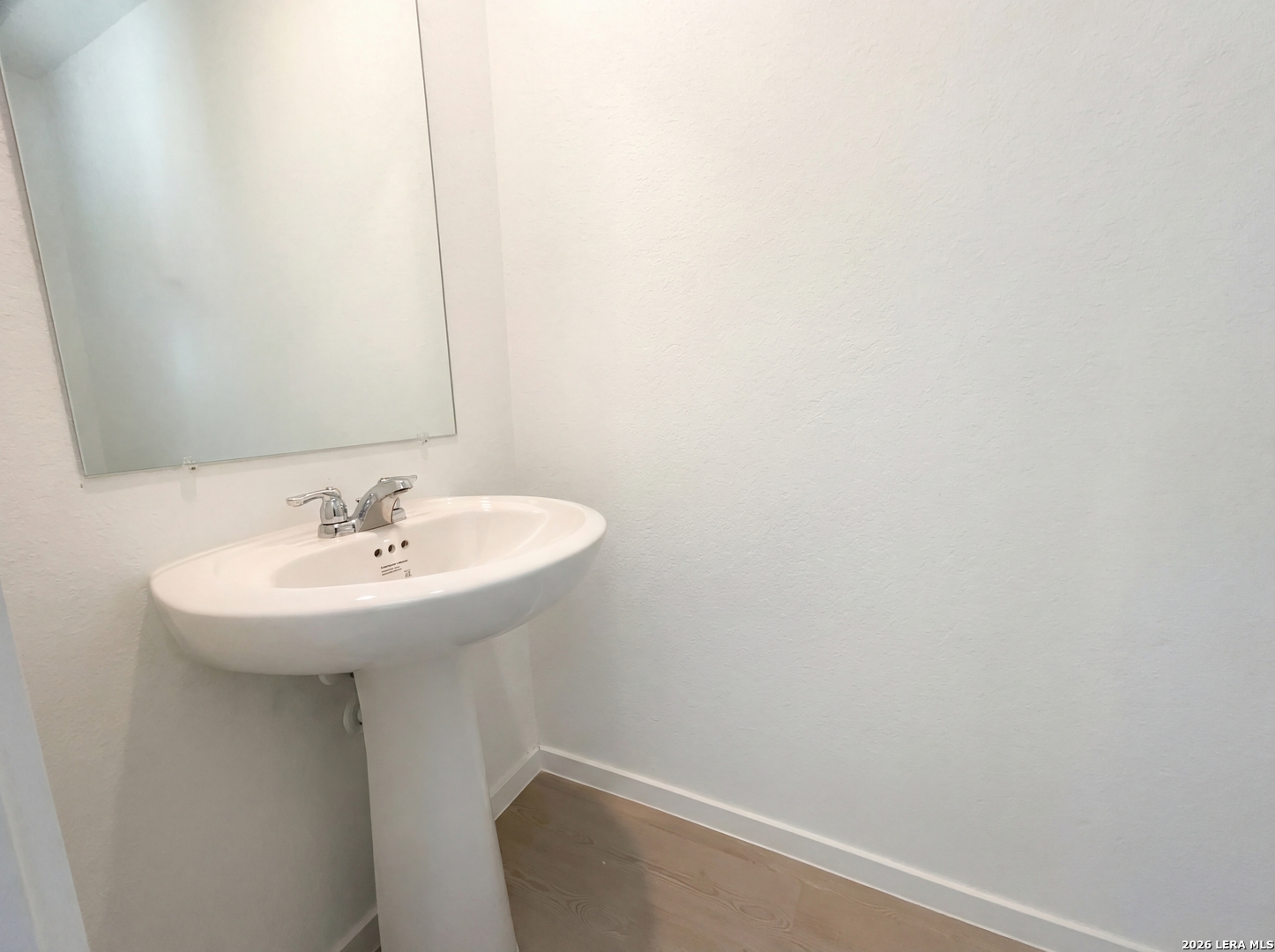 320 Pacific Waters Seguin, TX 78155 - Photo 6 of 16 a bathroom with a sink and mirror