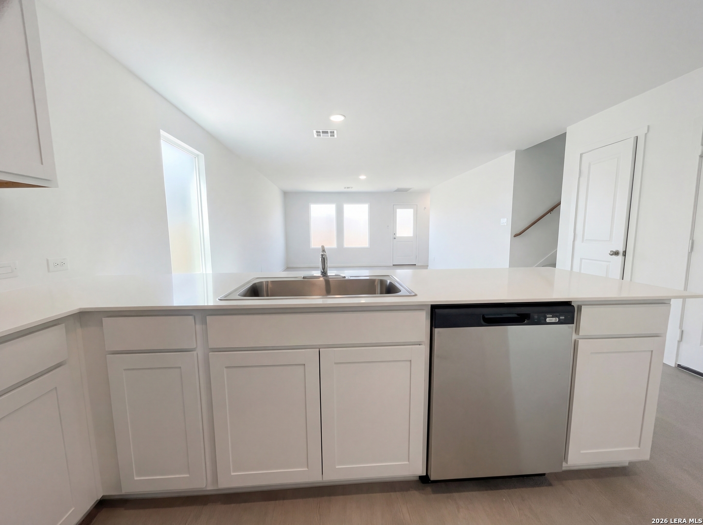320 Pacific Waters Seguin, TX 78155 - Photo 8 of 16 a kitchen with white cabinets and sink