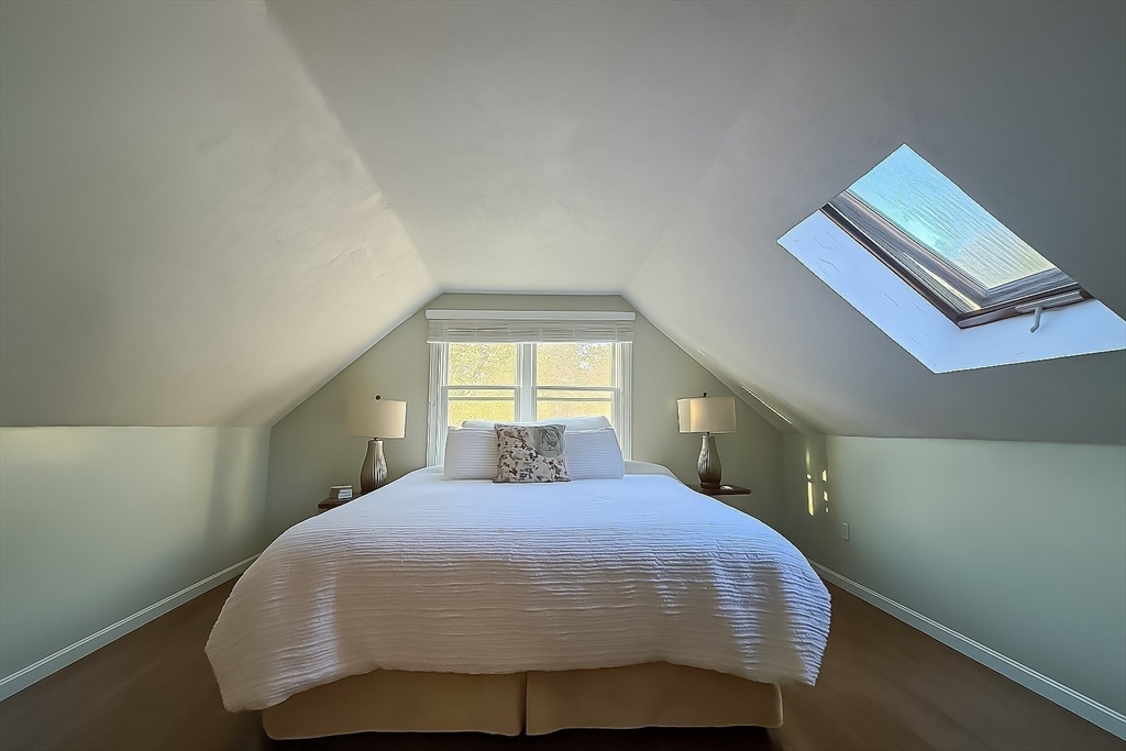 61 Wintergreen Road Mashpee, MA 02649 - Photo 19 of 35 a bedroom with a bed and window