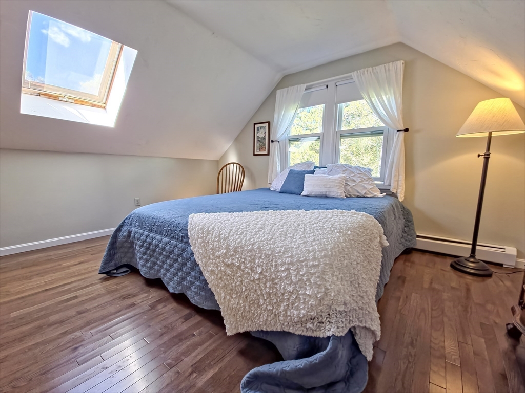 61 Wintergreen Road Mashpee, MA 02649 - Photo 22 of 35 a bedroom with a bed and a window