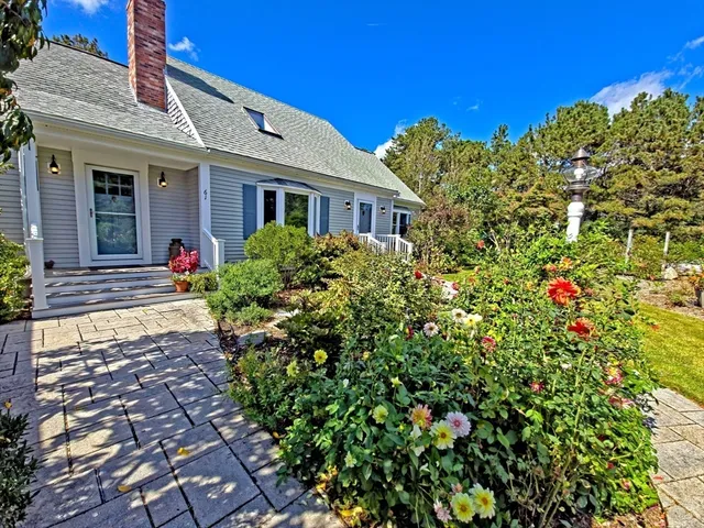 an aerial view of a house with a garden